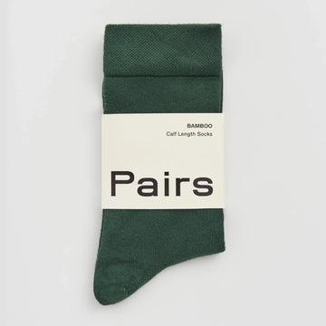 Green sock with 'Pairs' branding on a white background
