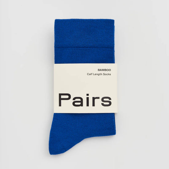 Blue sock with 'Pairs' label on a white background