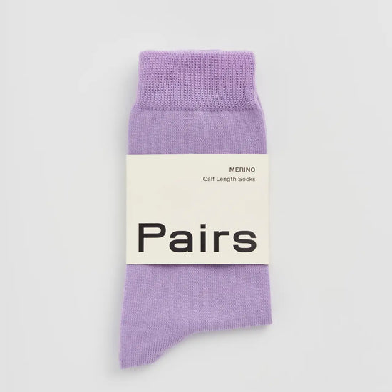 Lilac sock with a 'Pairs' label on a white background