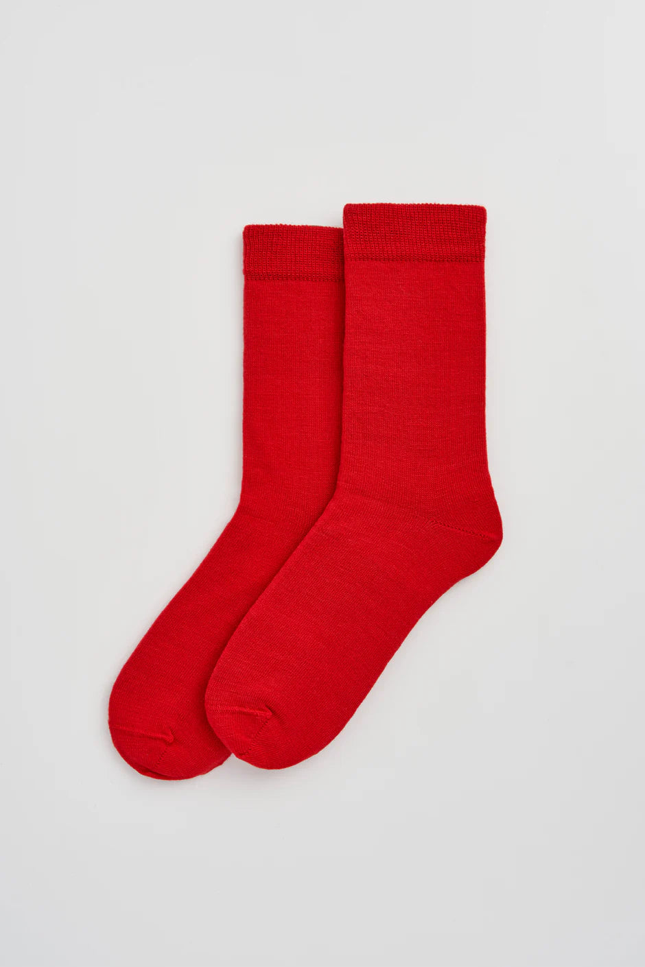 Red socks on a light grey background