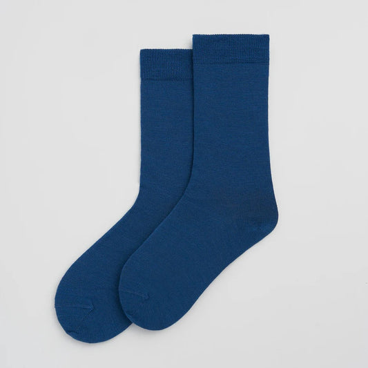 Pair of blue socks on a white background