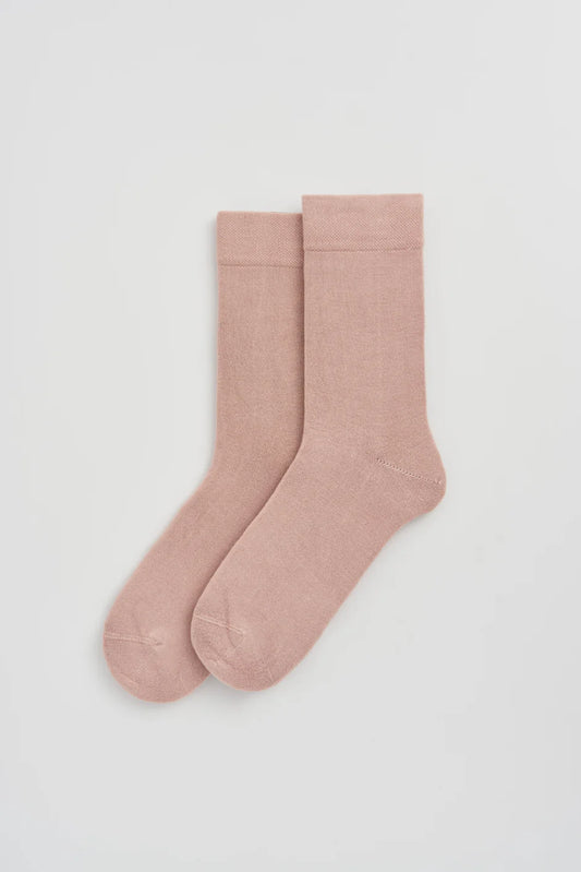 Pair of pink socks on a white background