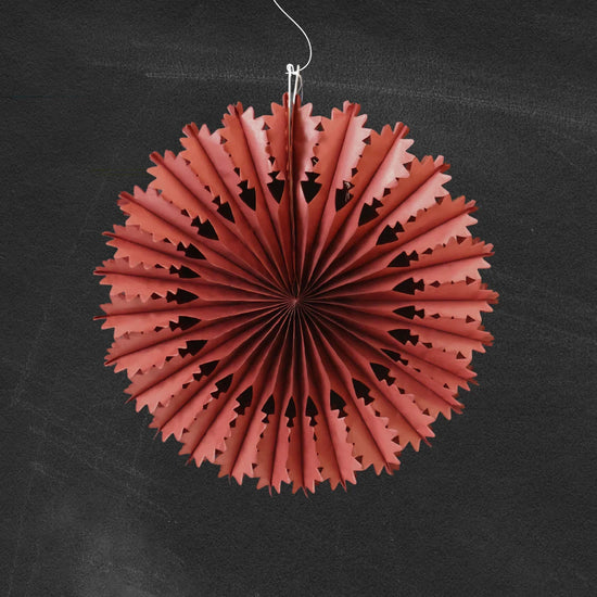 Chestnut paper fan decoration on a black background