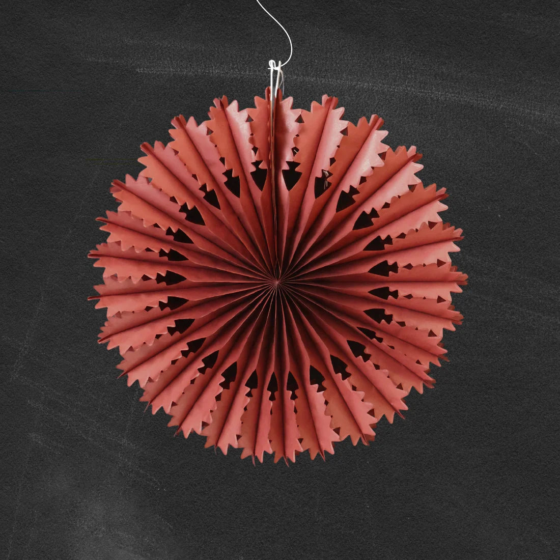 Chestnut paper fan decoration on a black background