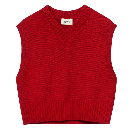 Red knitted vest on a white background