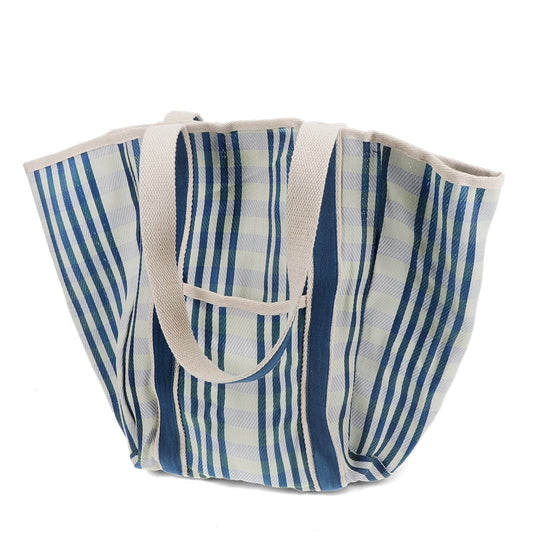 Blue and white striped tote bag with a cream strap on a white background