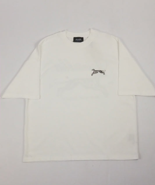 White shirt with a small logo on a light gray background