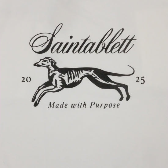 White baby onesie with black graphic and text on a white background