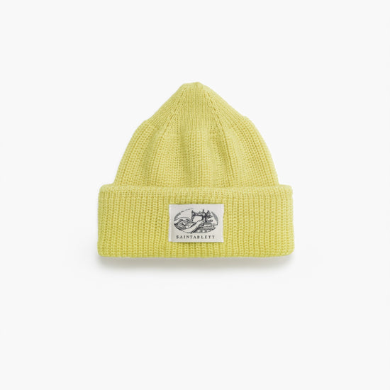 A yellow hat on a white background 