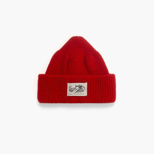 A red beanie on a white background 