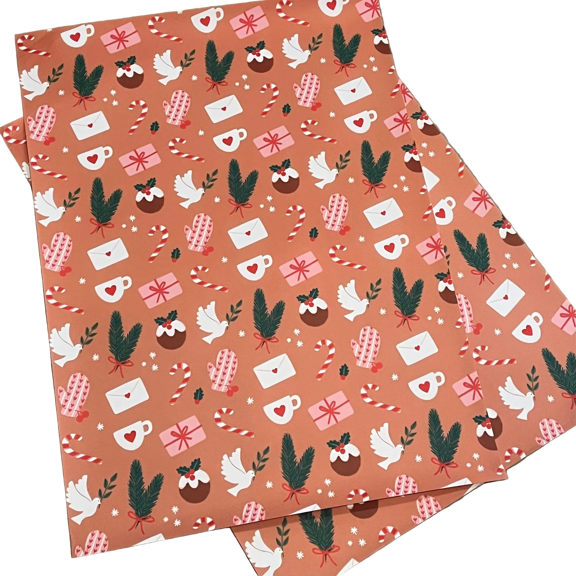 Christmas-themed wrapping paper with festive designs 