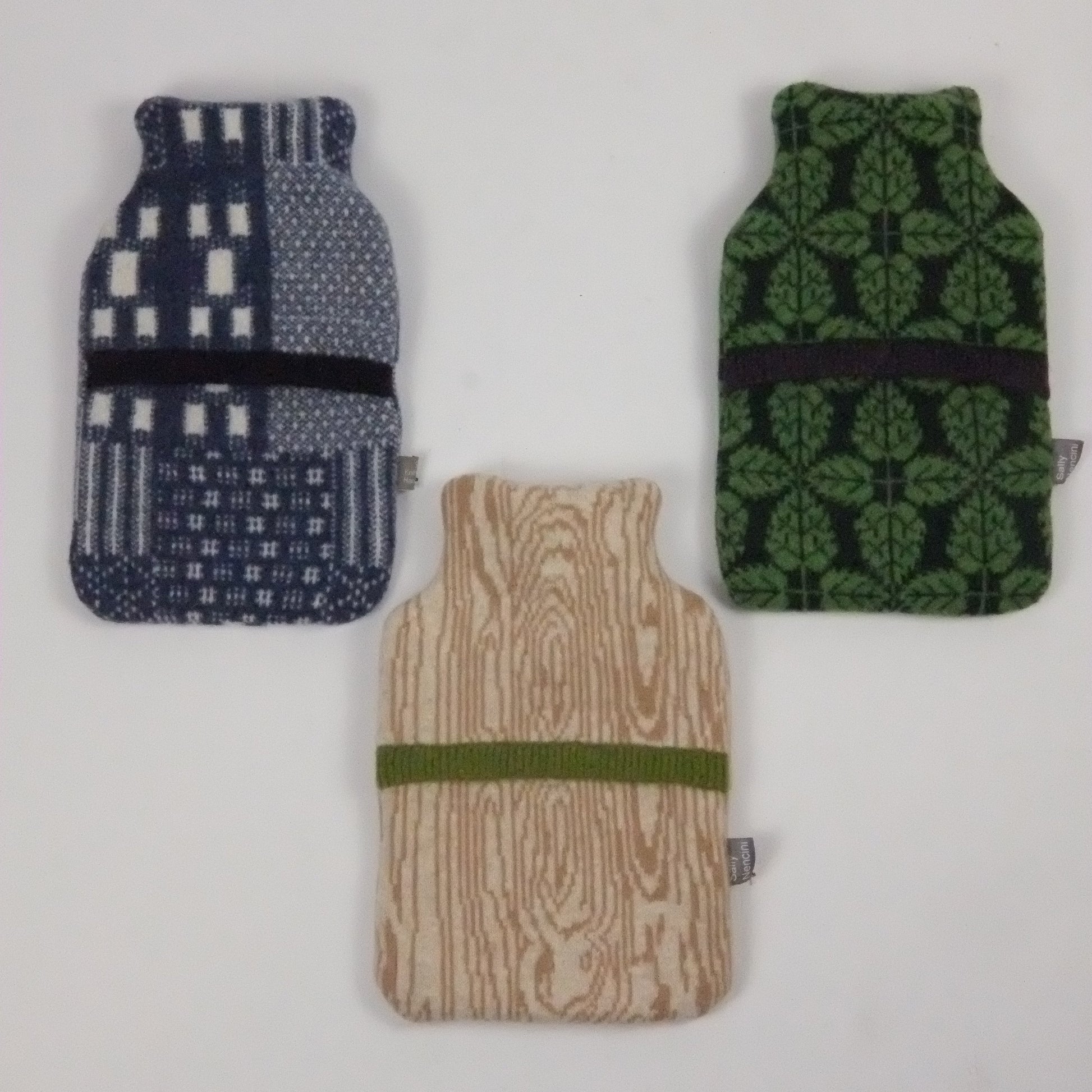 Three knitted pouches with different patterns on a white background