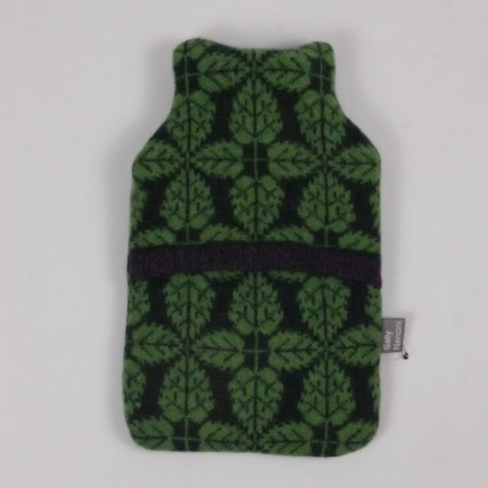 Green and black patterned pouch on a white background