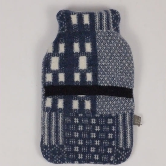 Textured blue and white pouch on a light gray background