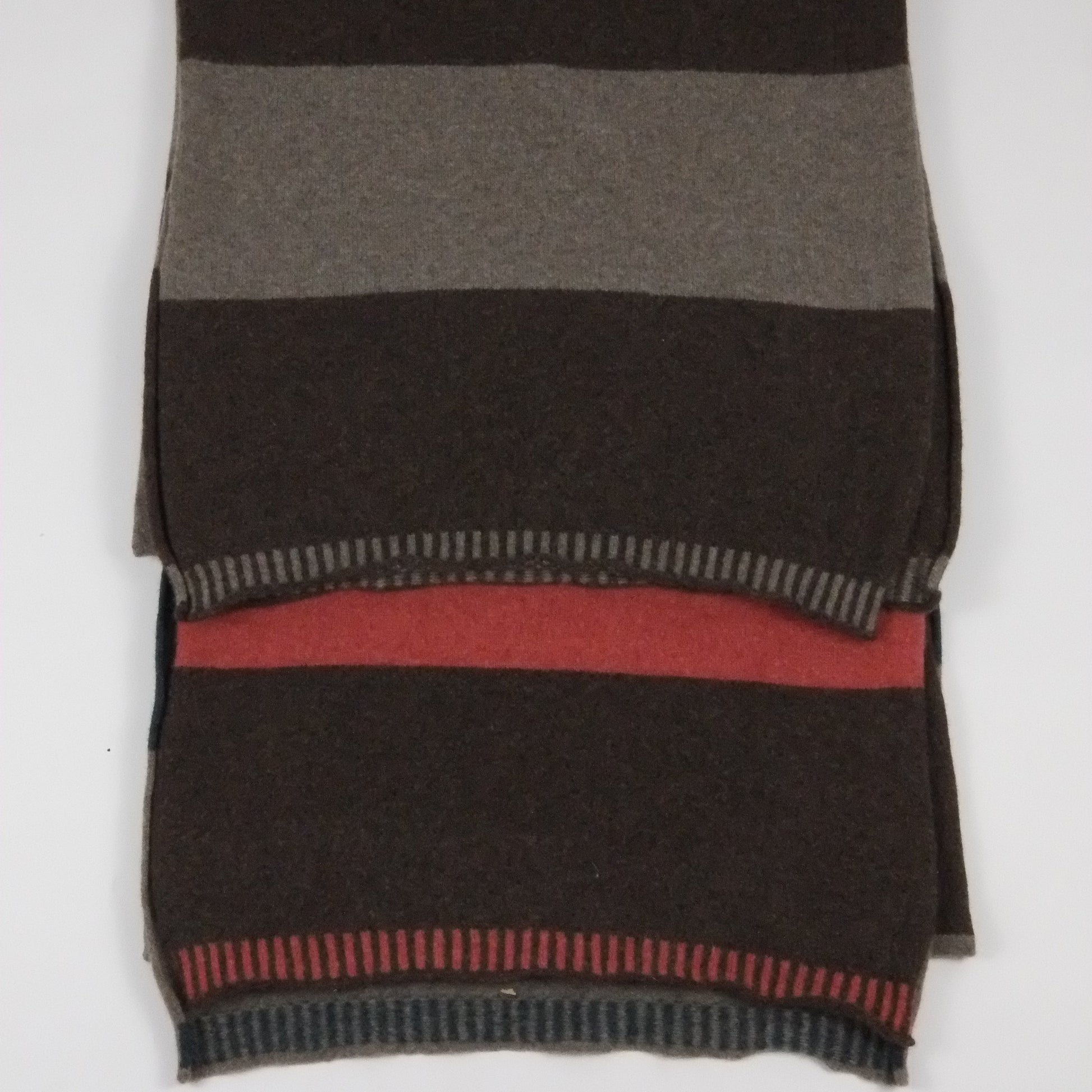 Striped fabric with brown, gray, and red colors on a white background