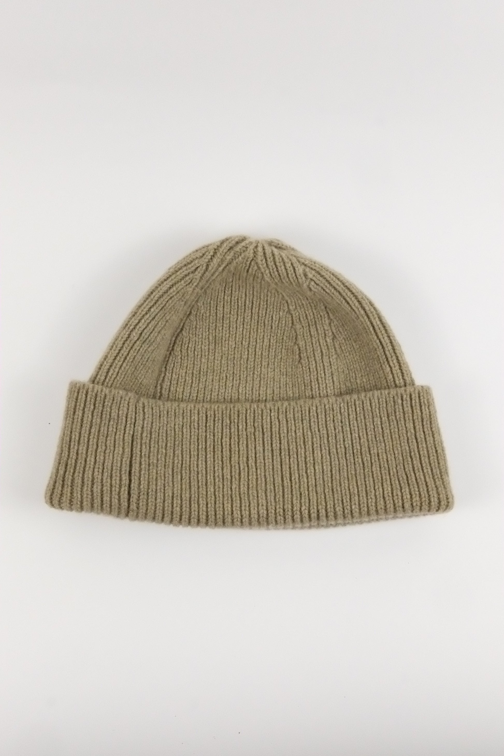 Khaki knit beanie on a white background