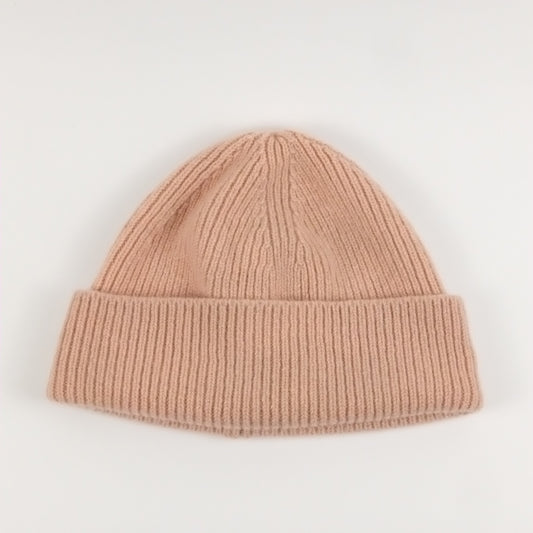 pink knit beanie on a white background
