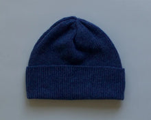 Load image into Gallery viewer, Blue knit beanie on a light grey background
