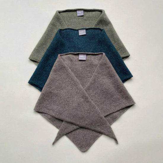 Three folded scarves on a white background 