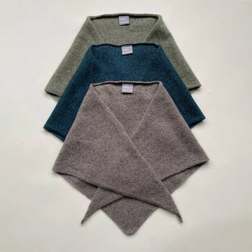 Three folded scarves on a white background 