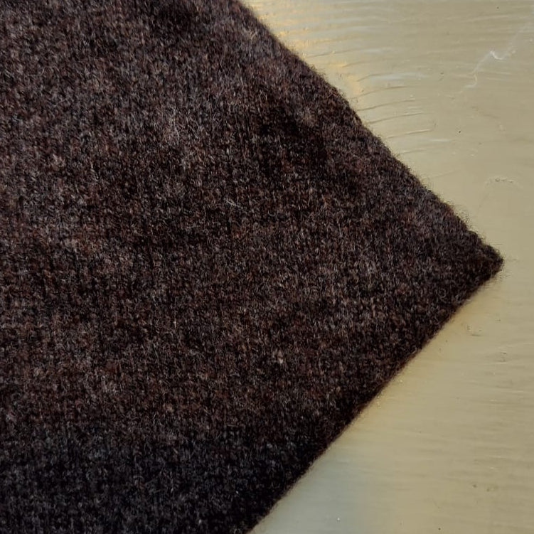A brown scarf on a beige background 