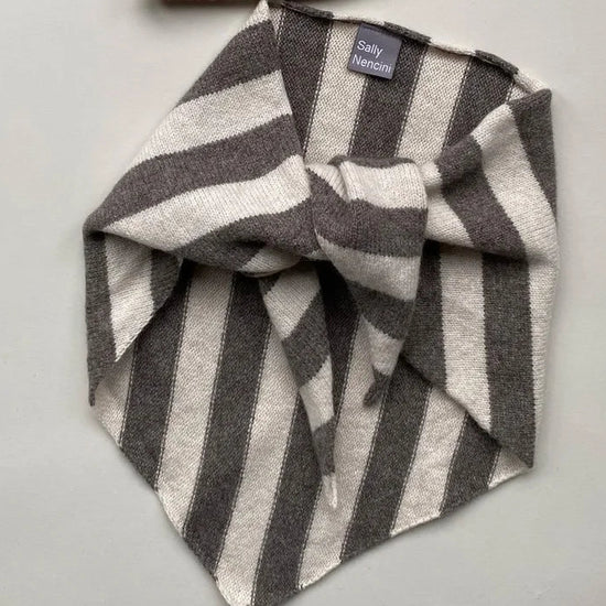 Grey and white striped scarf on a white background 