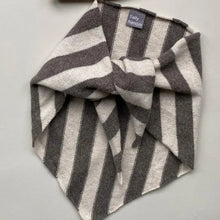 Load image into Gallery viewer, Grey and white striped scarf on a white background 
