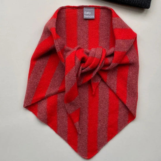 Pink and red striped scarf on a white background 