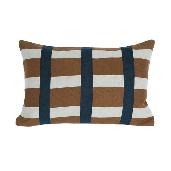 Striped pillow with brown, white, and navy pattern on a white background