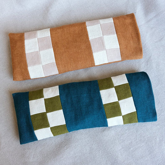 Two lavender pillows on a neutral background 