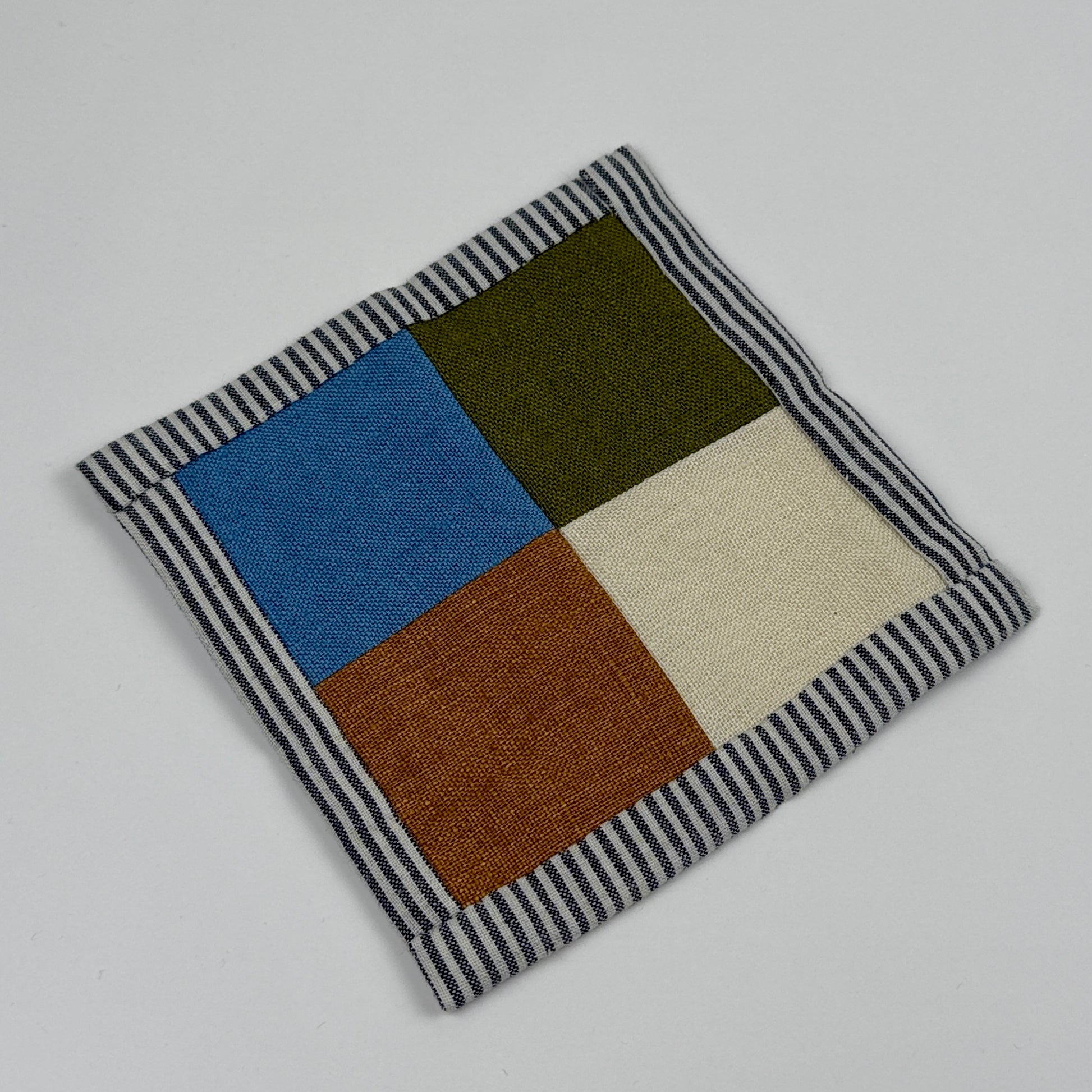 patchwork linen coaster on a white background