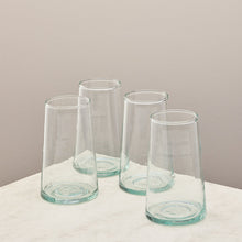 Load image into Gallery viewer, Four clear glass tumblers on a white surface with a beige background
