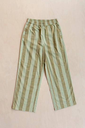 Striped trousers with green and brown pattern on a beige background