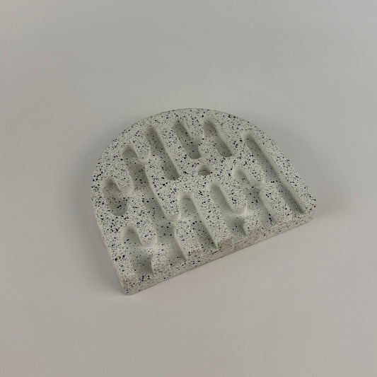 Concrete block with a unique design on a gray background