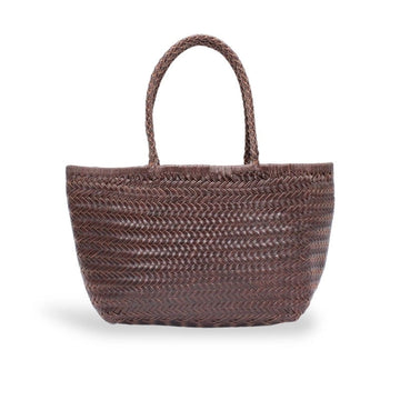 A brown woven straw tote bag with two braided shoulder straps, shown against a plain white background.