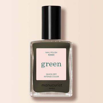 a bottle of khaki nail varnish on a cream background