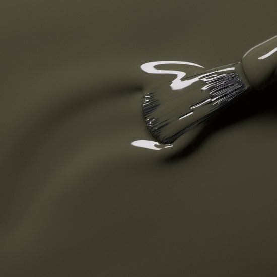 liquid khaki nail varnish with a brush in situ 