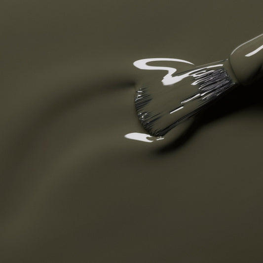 liquid khaki nail varnish with a brush in situ 