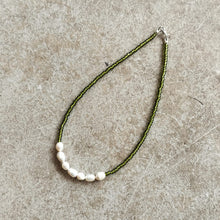 Load image into Gallery viewer, Pearl and seed bead necklace in Green on a beige background
