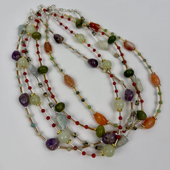 Multicolored beaded necklace on a white background