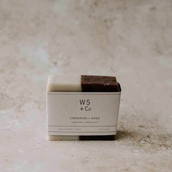 Bar of soap with packaging labeled 'WS + Co' on a textured surface