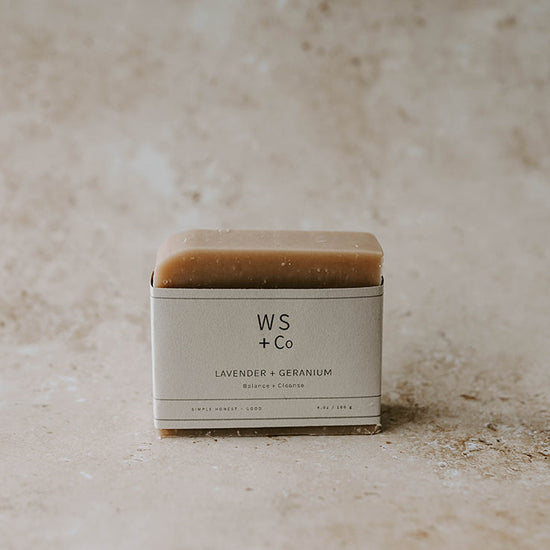 A bar of soap on a beige background 
