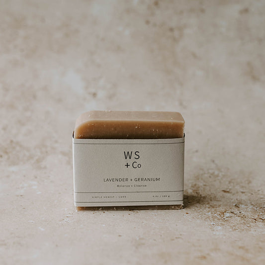 A bar of soap on a beige background 
