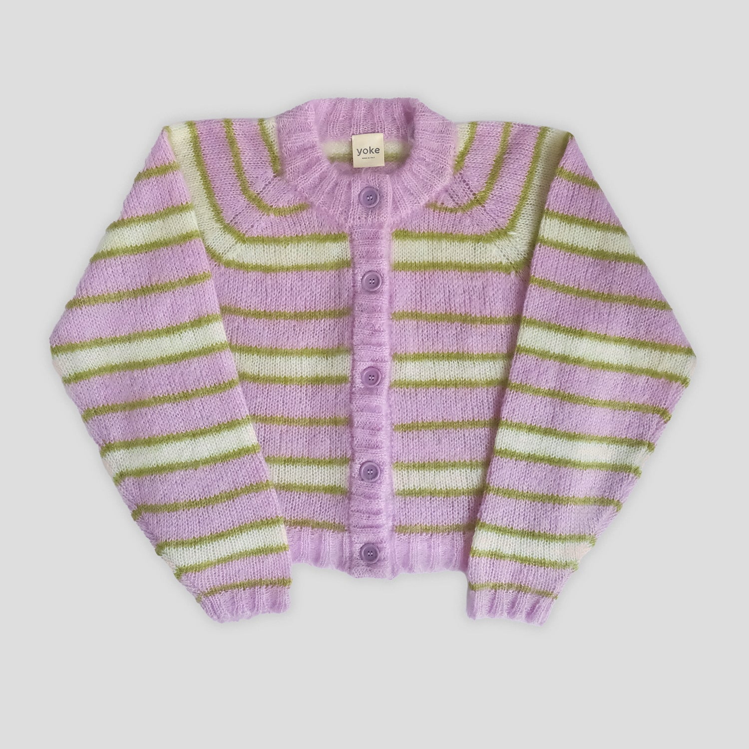 Striped cardigan with purple, green, and white colors on a light gray background