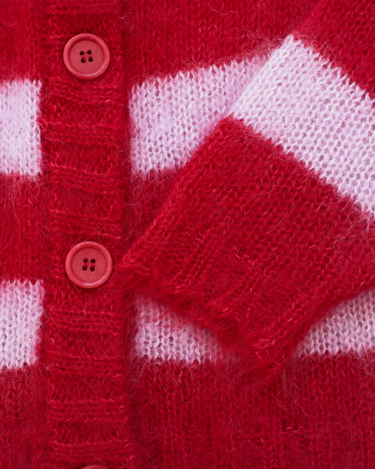 Close-up of a red and white striped mohair knit cardigan with pinkish-red buttons.