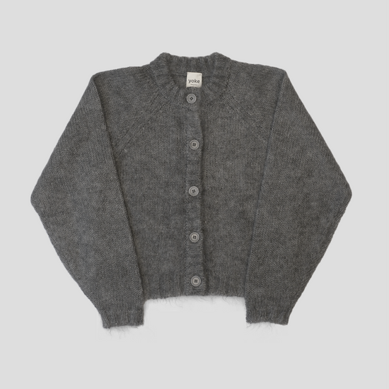 A grey cardigan on a white background 