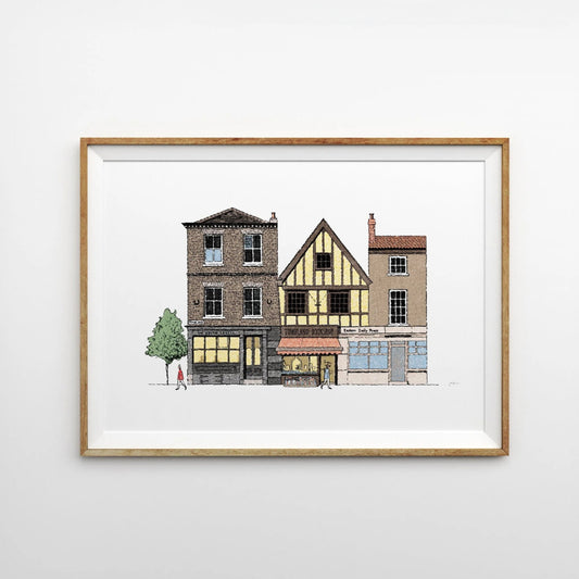 Illustrated print of Tombland in Norwich with some local iconic architecture on a white background. Framed horizontally with a thin light wooden frame on a light grey background