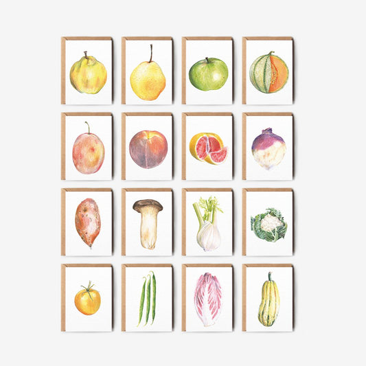 Set of illustrated greetings card prints of fruits and vegetables on a white wall