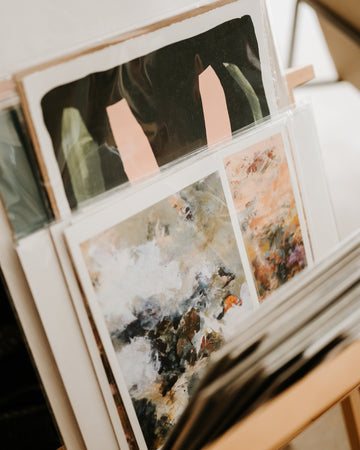 art prints in a print display rack