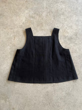 Load image into Gallery viewer, Black sleeveless top on a light gray surface
